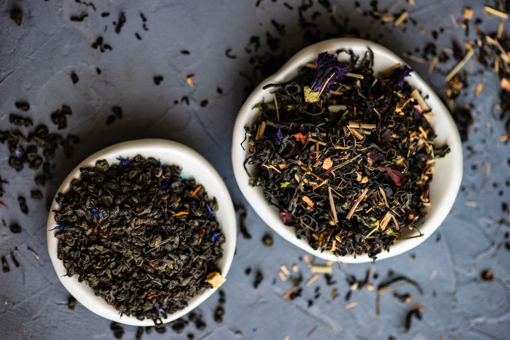 Two bowls of tea leaves