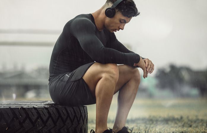 Male athlete resting after intense cross training workout