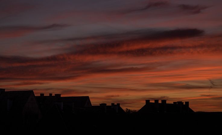 Fire red sky over French rooftops