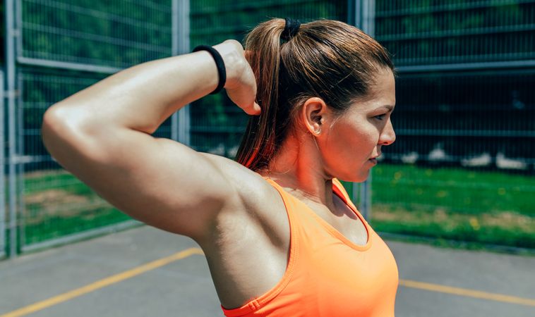 Sportswoman doing arm stretches