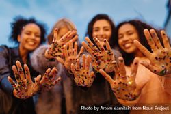 Group of woman with confetti on their hands 5n3qm4
