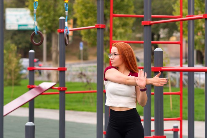Woman stretching arms across chest