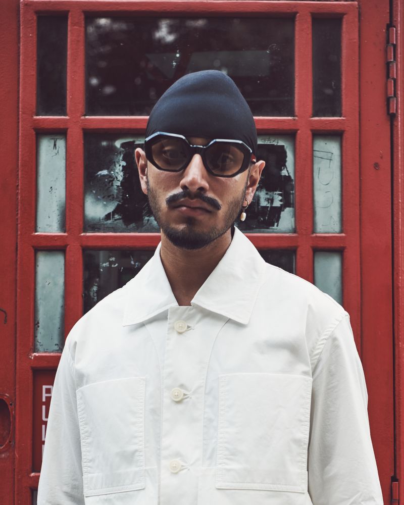 London, England, United Kingdom - September 18 2021: Man in geometric sunglasses, vertical