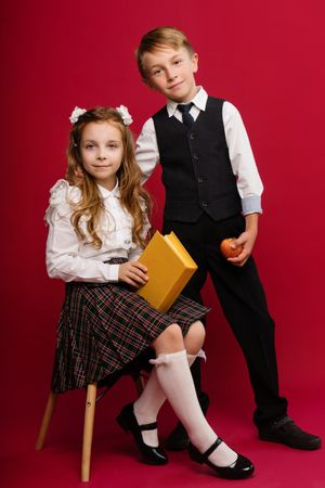 Schoolchildren in uniform with book