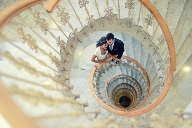 Looking down at a married couple  spiral staircase