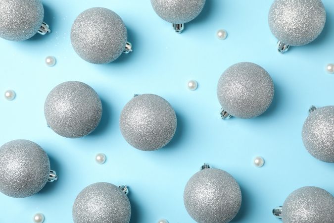 Christmas balls on blue background, top view