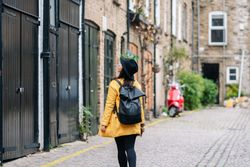 Anonymous traveler walking on the street