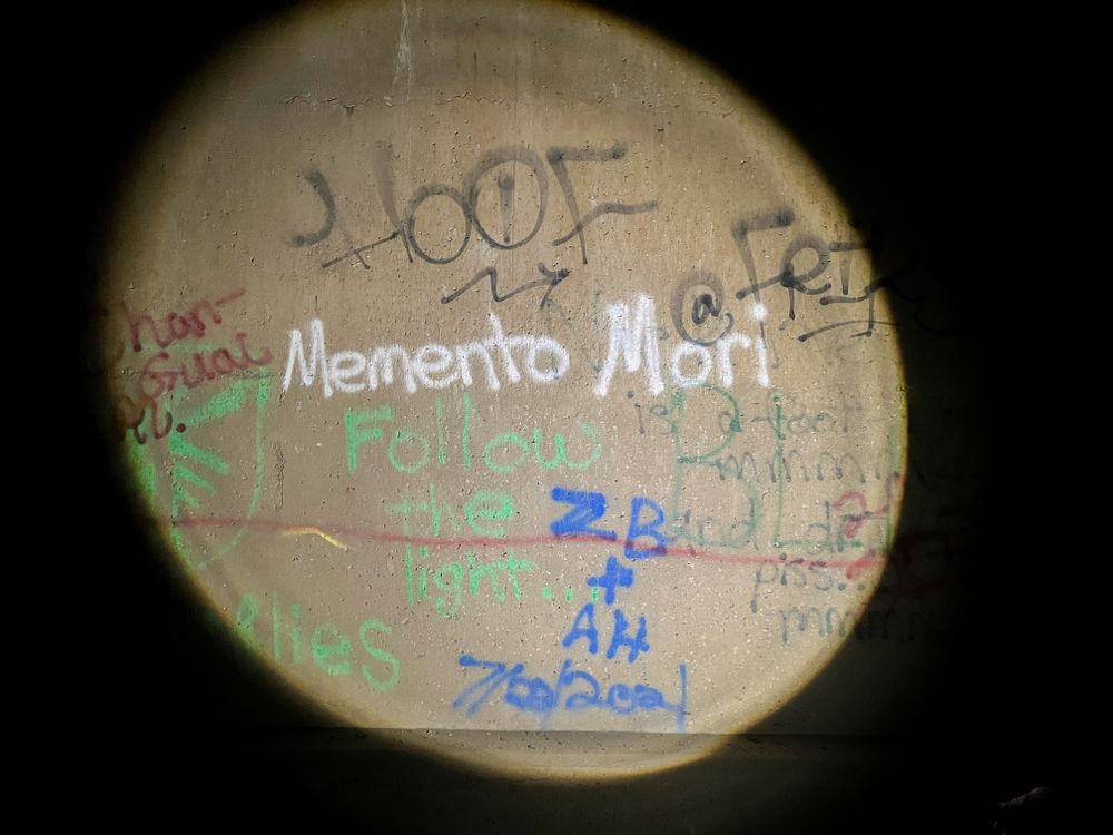 Light on grafitti in dark room