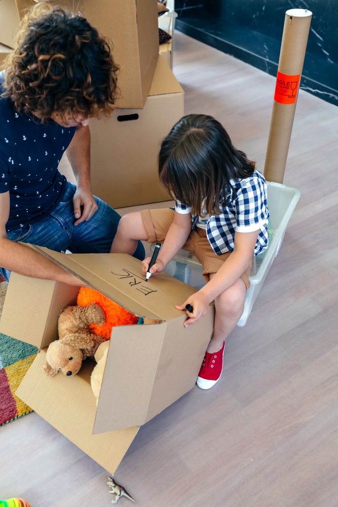 Boy writing in a moving box