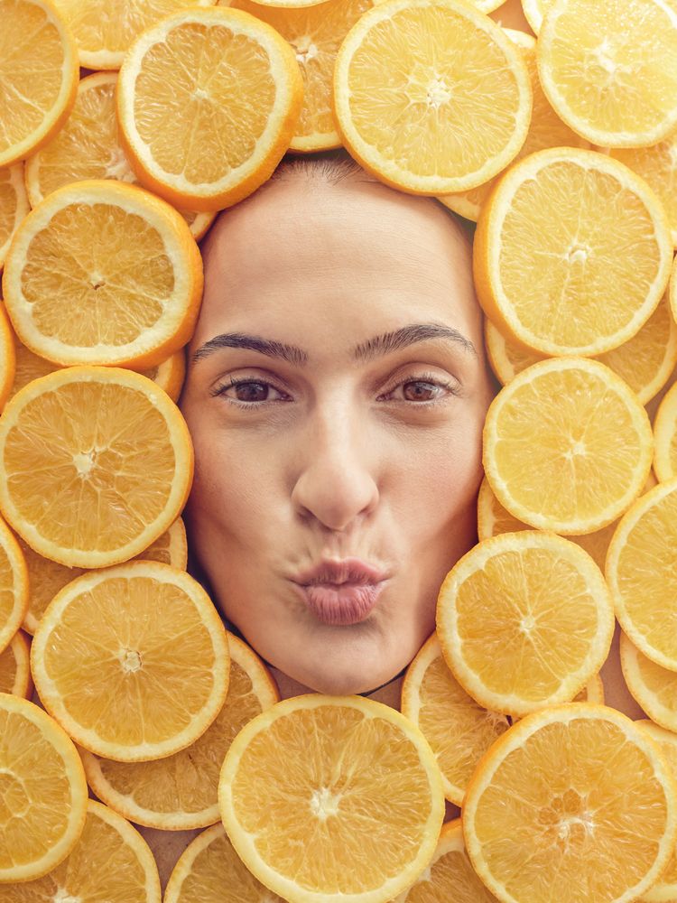 Female face with pouting lips in orange pieces