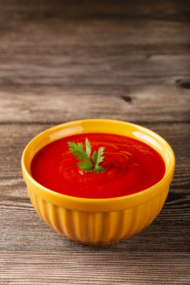 Delicious homemade tomato soup in bowl.