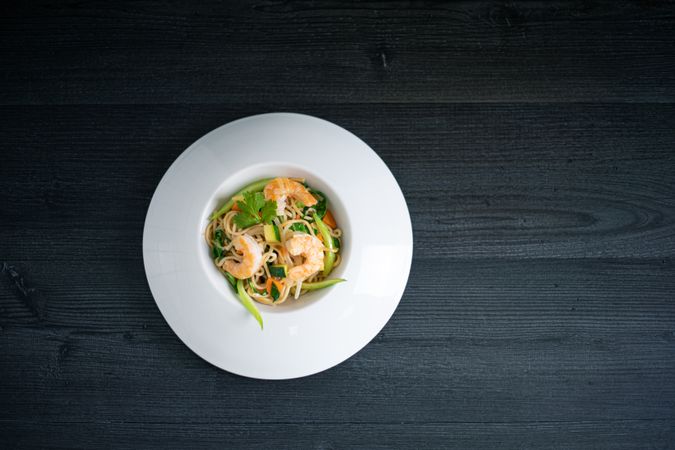 Tasty Pad Thai of vegetables and prawns in plate
