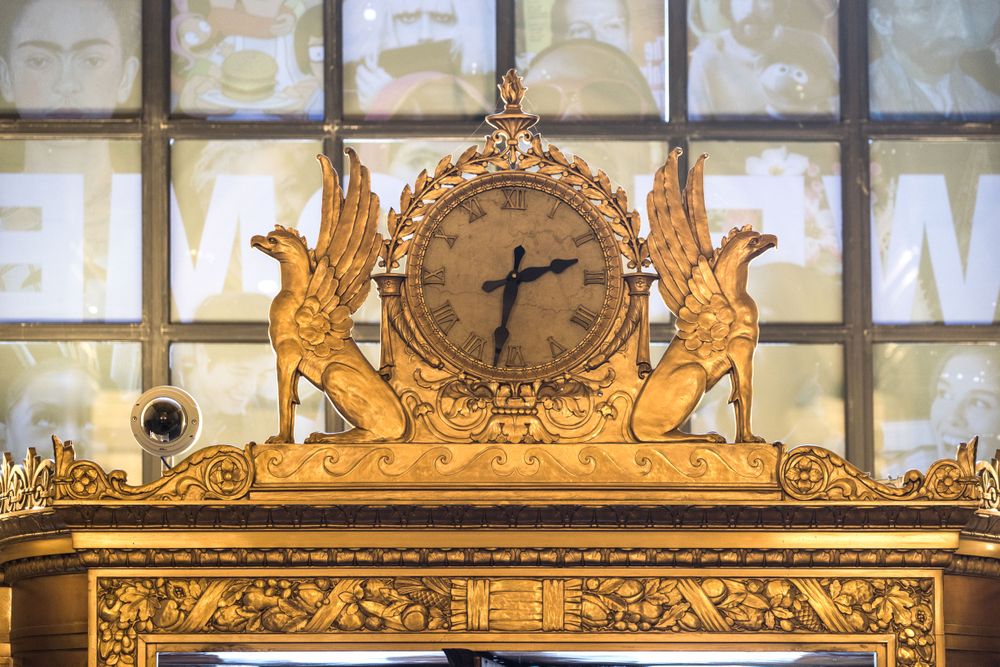 Gilded clock above a door inside the Cleveland Public Library's main building in Cleveland, Ohio