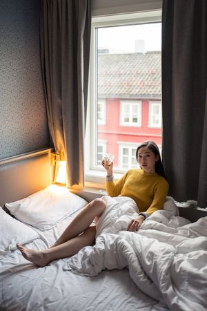Female drinking tea in morning