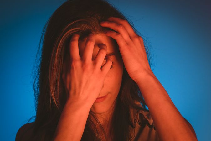 woman touching her hair