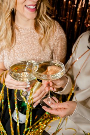 Close Up of cheerful woman at Party Making Champagne Toast Together