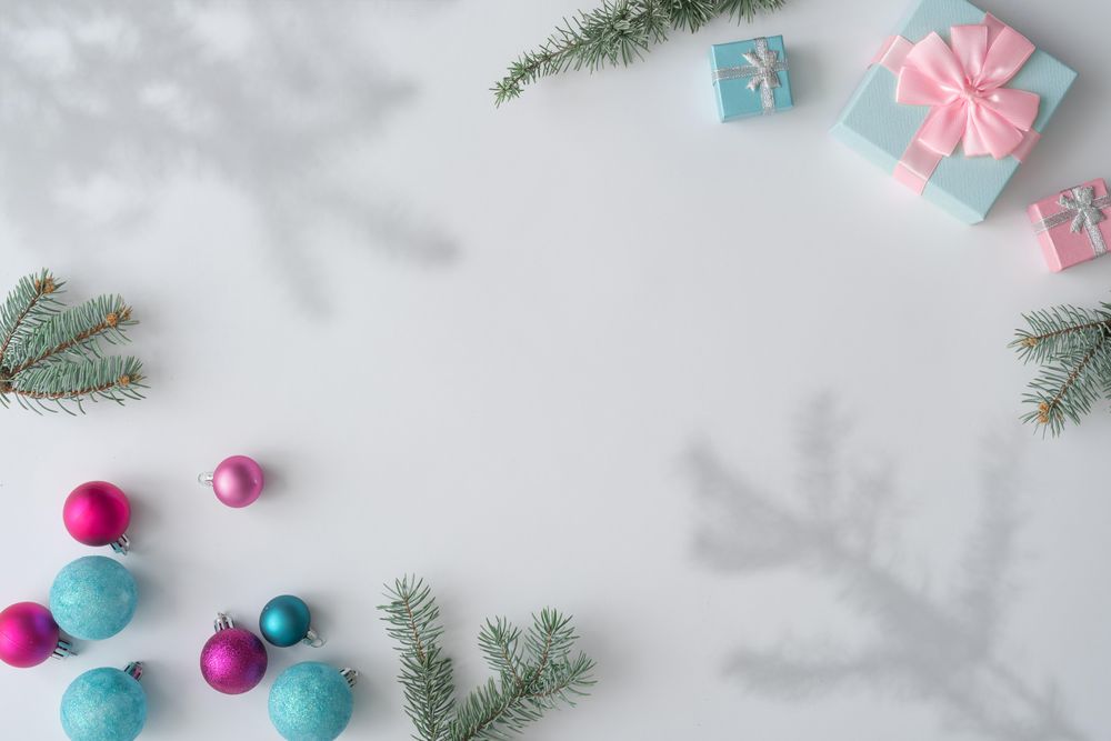 Christmas decorations, gifts with branches, and shadows on corners of light background