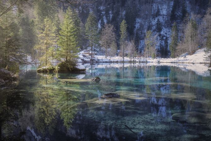 Tranquil blue lake in snowy mountains