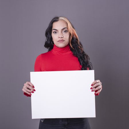 woman holding a blank sign