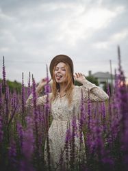 Romantic women in salvia field