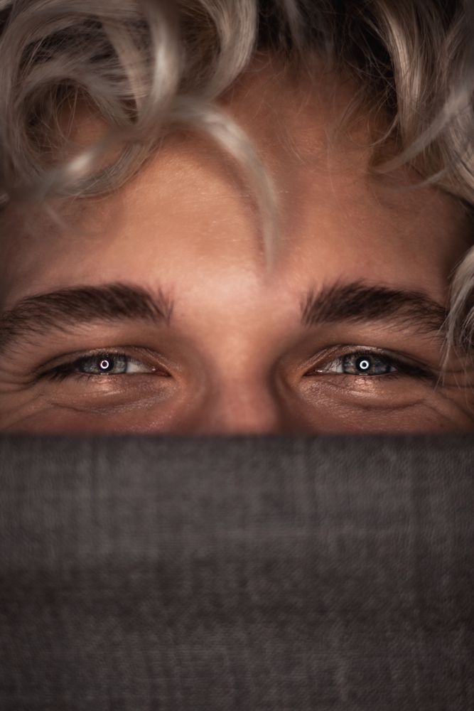 Young man's happy blue eyes