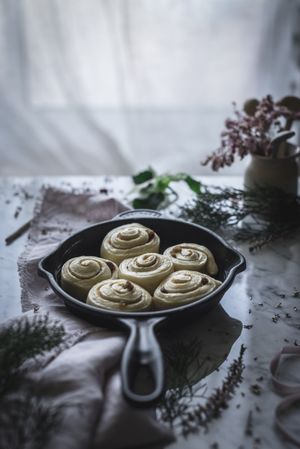 Fresh cinnamon rolls on table