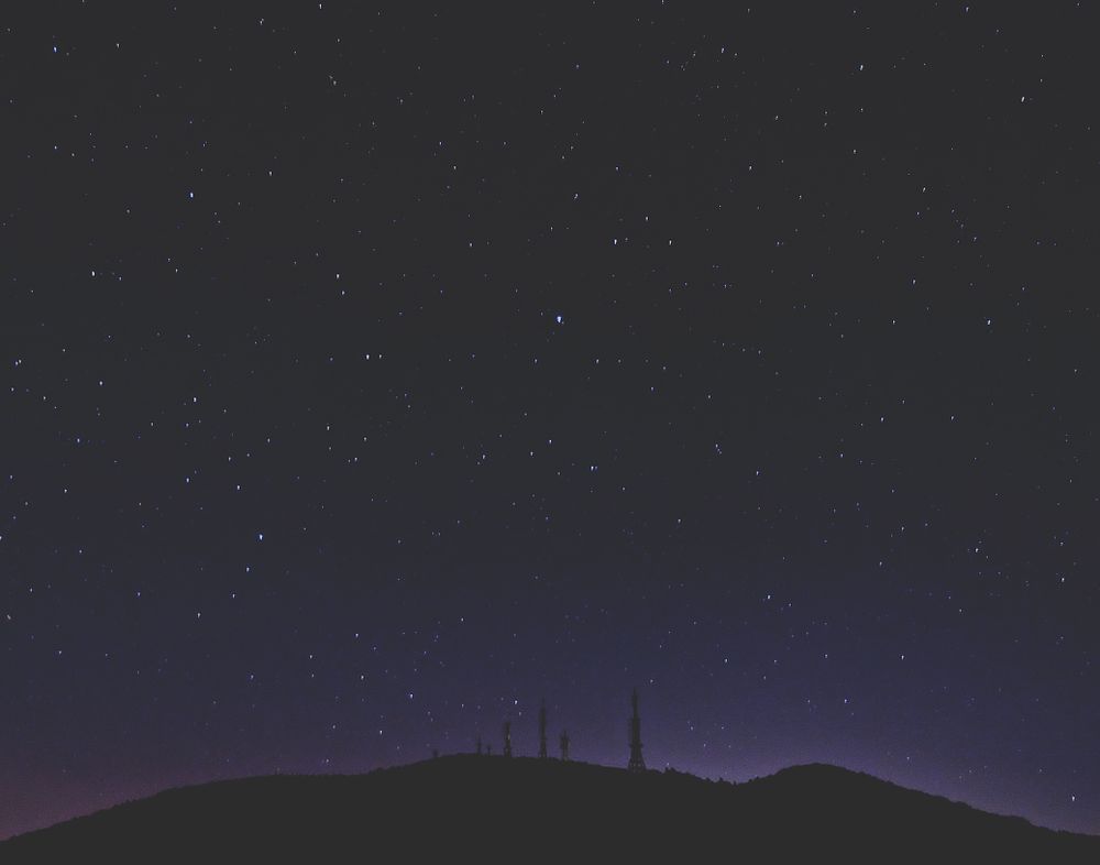 Mountain under starry sky