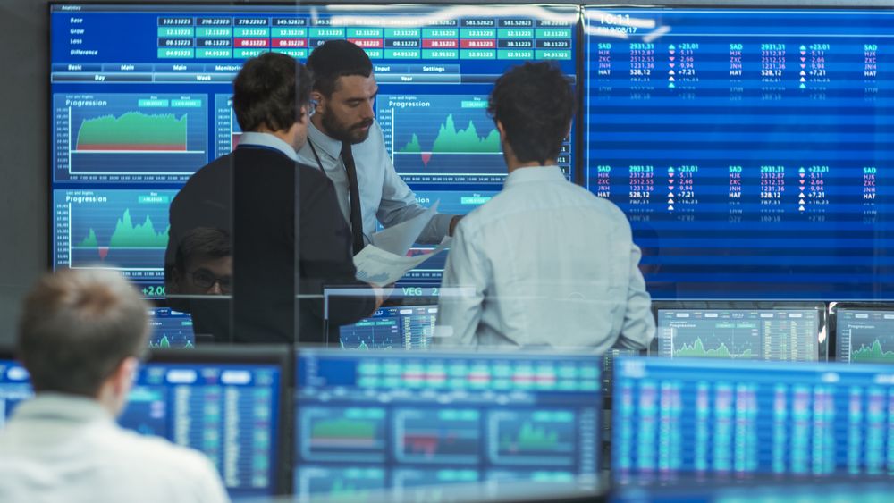 Three Experienced Stock Traders Talking Business.