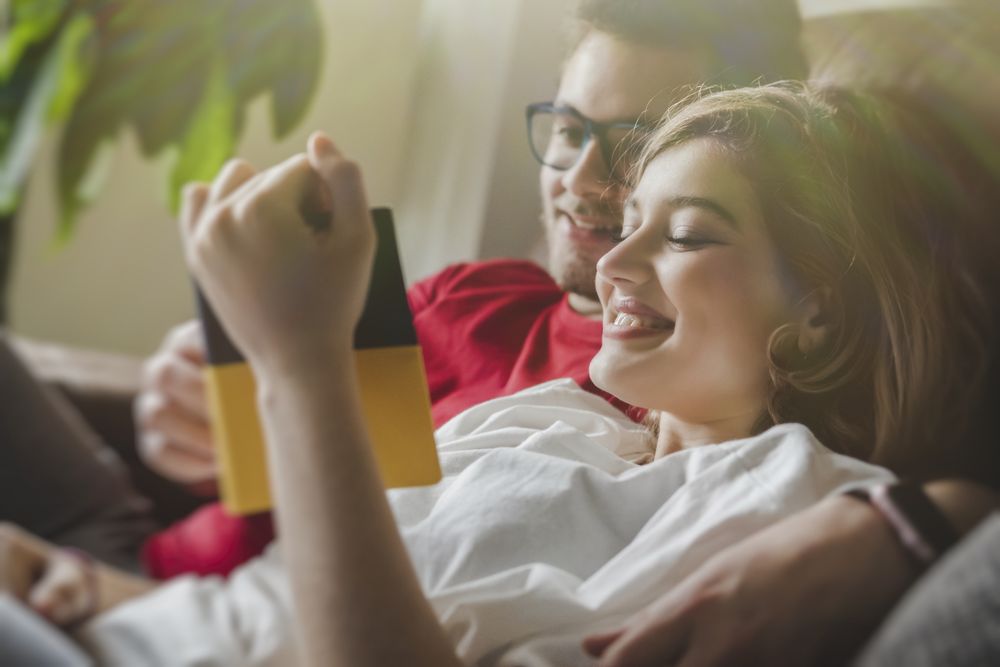 Dreamy couple with brochure