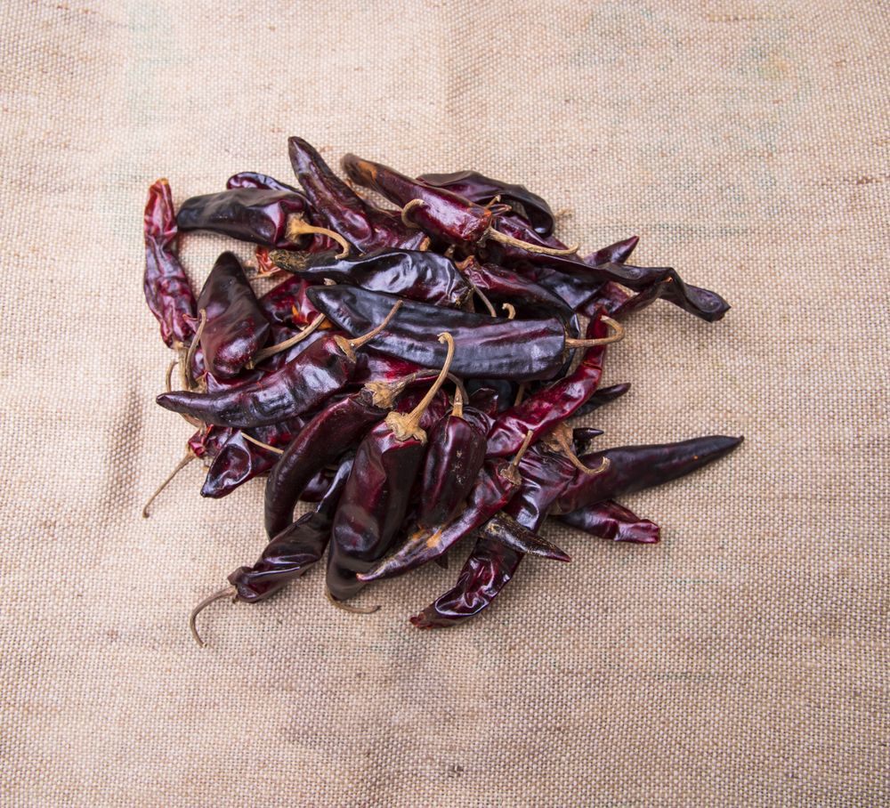Some Dry Pepper or red chili on the brown jute fiber fabric