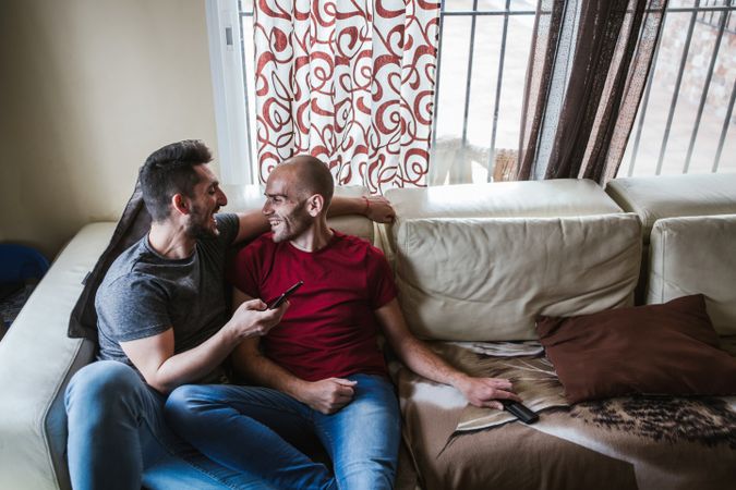 young gay couple at home