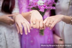 Cropped image of three women wearing engagement ring 0KRpzb