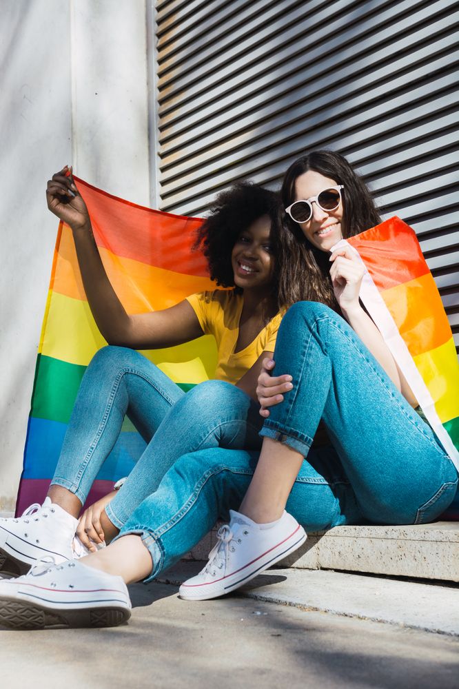 Lesbian couple with LGBT flag