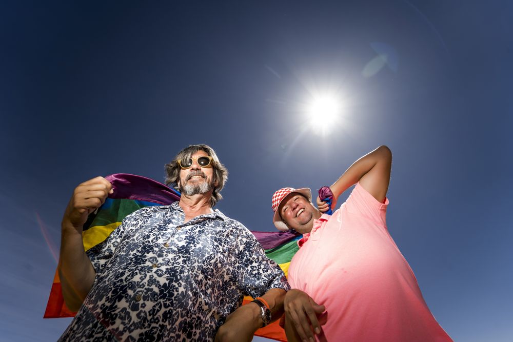Excited gay couple in desert