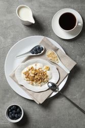 Tasty and nutritious breakfast concept - muesli with yogurt