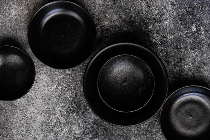 Round geometric dark bowls on counter
