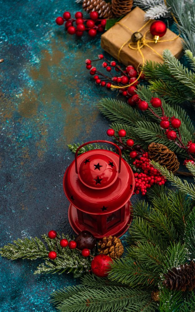 Top view of table with fir, holly, pine and Christmas gifts and decorations