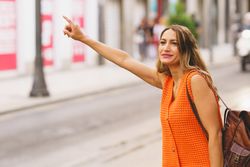 Woman hailing taxi