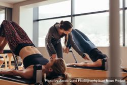 Two fitness women doing pilates training at the pilates gym bYXYd4