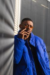 Stylish Black man in sunglasses on street