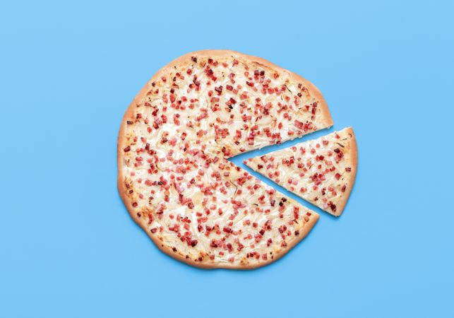 Tarte flambee above view on a blue background