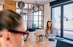Businesswoman with unicorn headband working