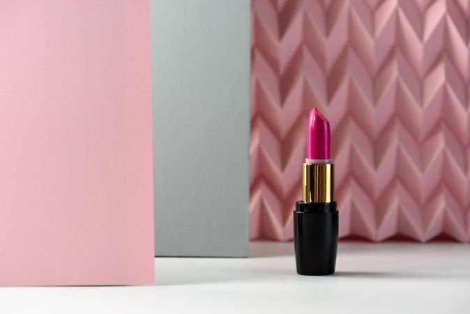 Lipstick on raised pink chevron. Product and make up concept