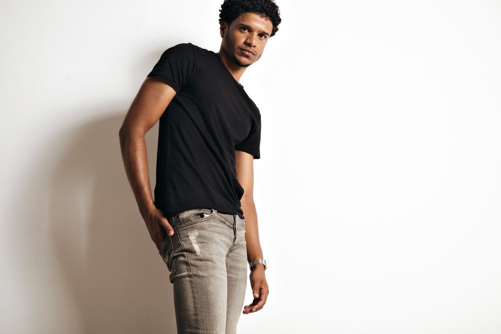 Male with hand in back jean pocket