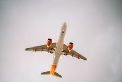 Big plane under grey sky