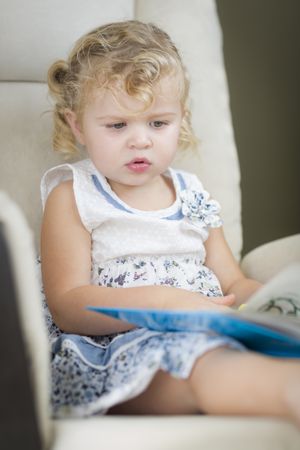 Curious Little Girl Reading Her Book