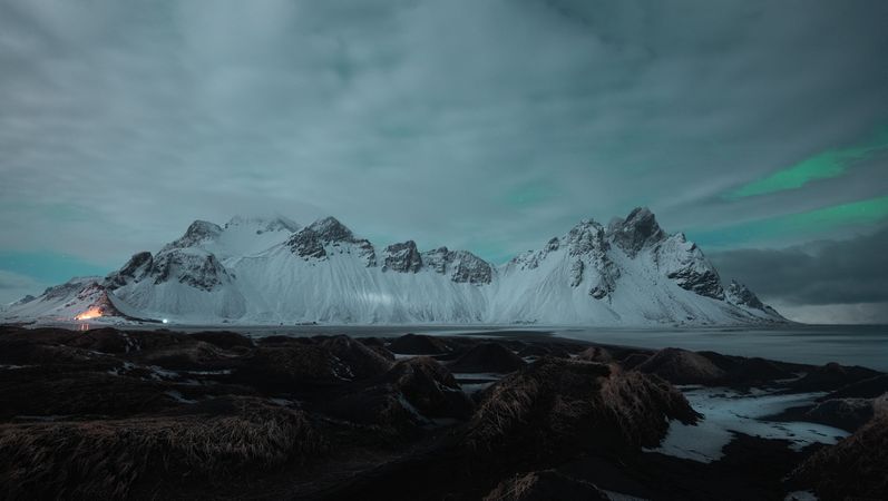 Snowy mountains covering with the fog