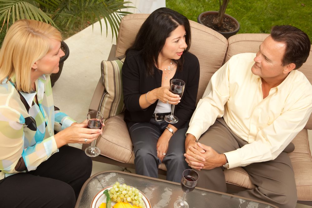 Three Friends Enjoying Wine on the Patio