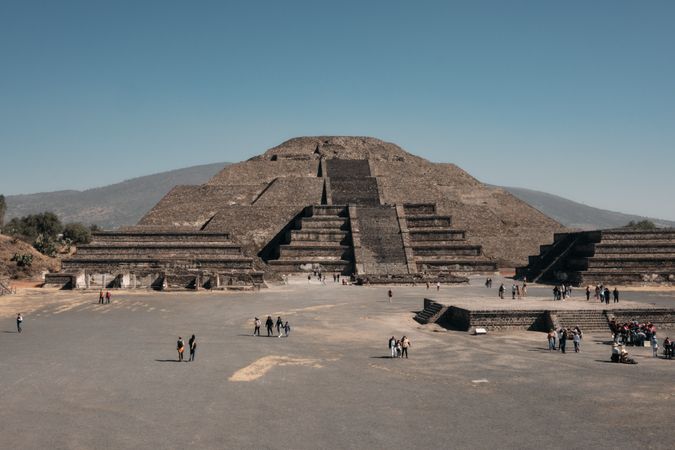 Tourists exploring ancient pyramids in Teotihuacan Valley