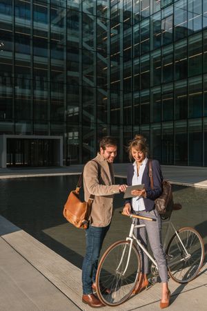 Businesspeople talking on street after work